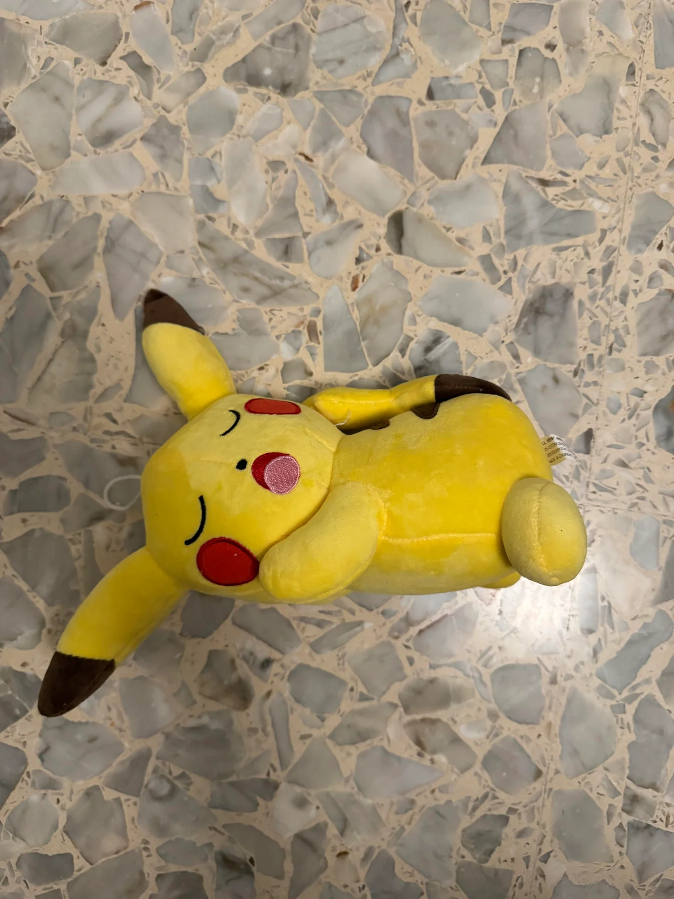 Yellow Pikachu plush toy.