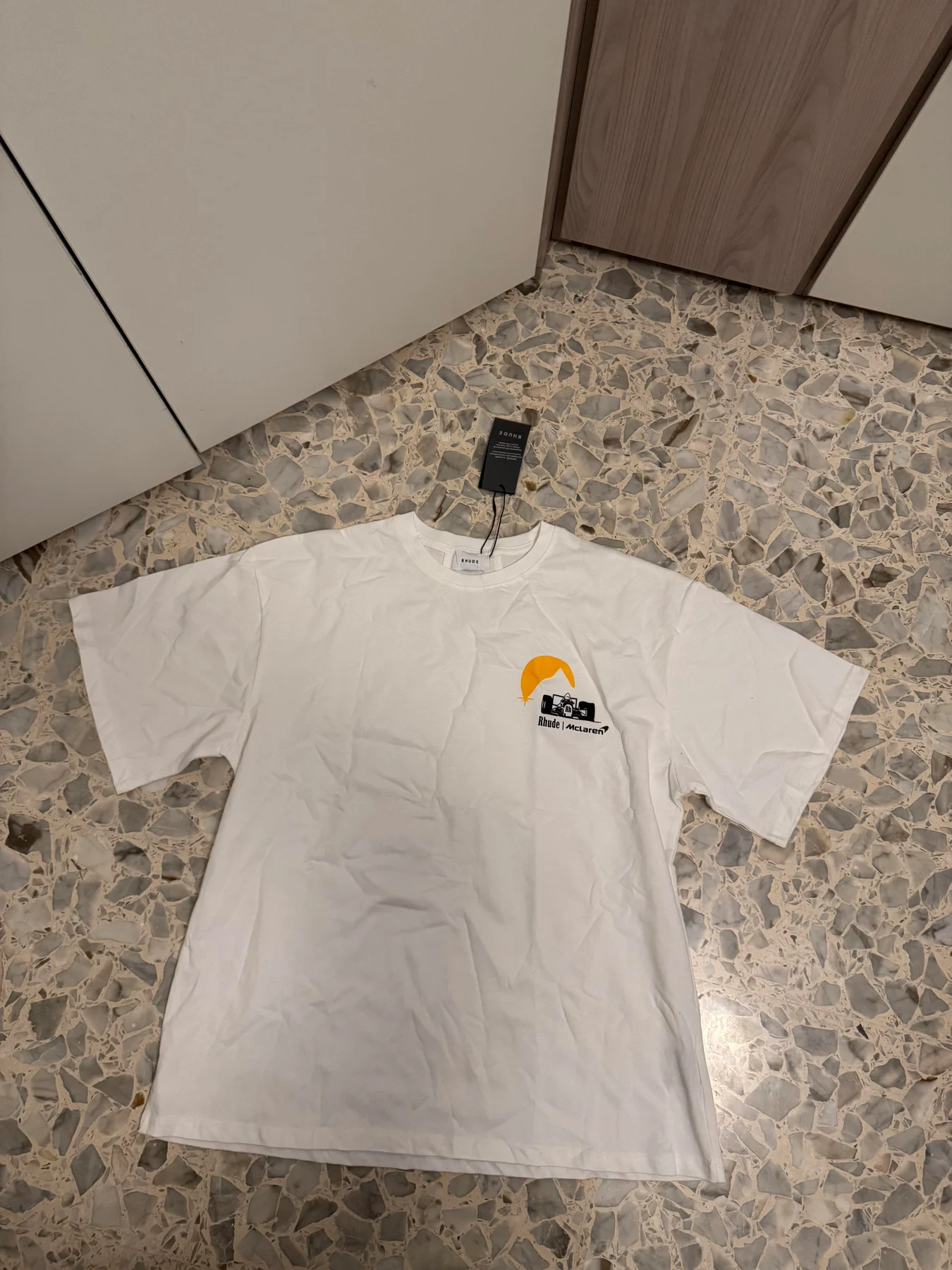 Front of a white graphic T-shirt.