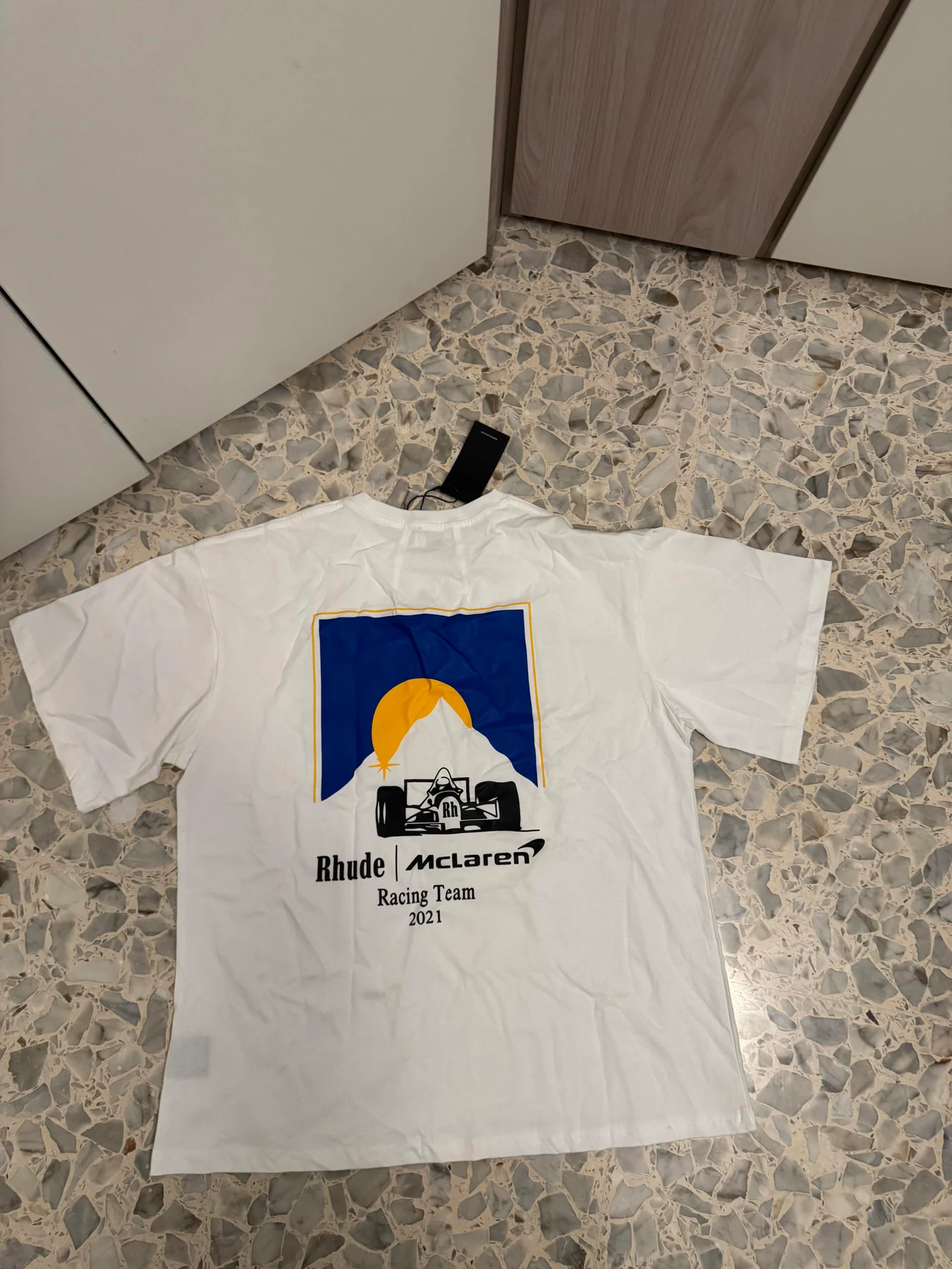 Back print on the white graphic T-shirt.