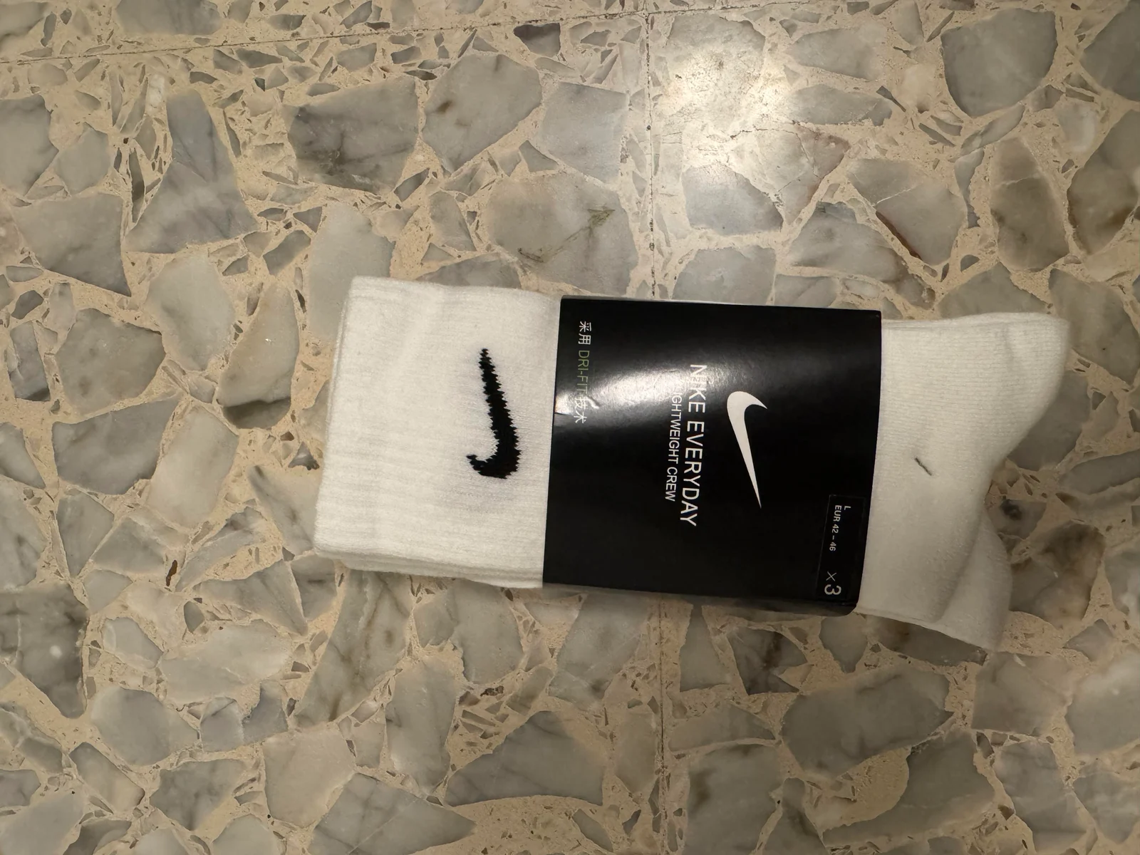 Packaged white Nike socks.