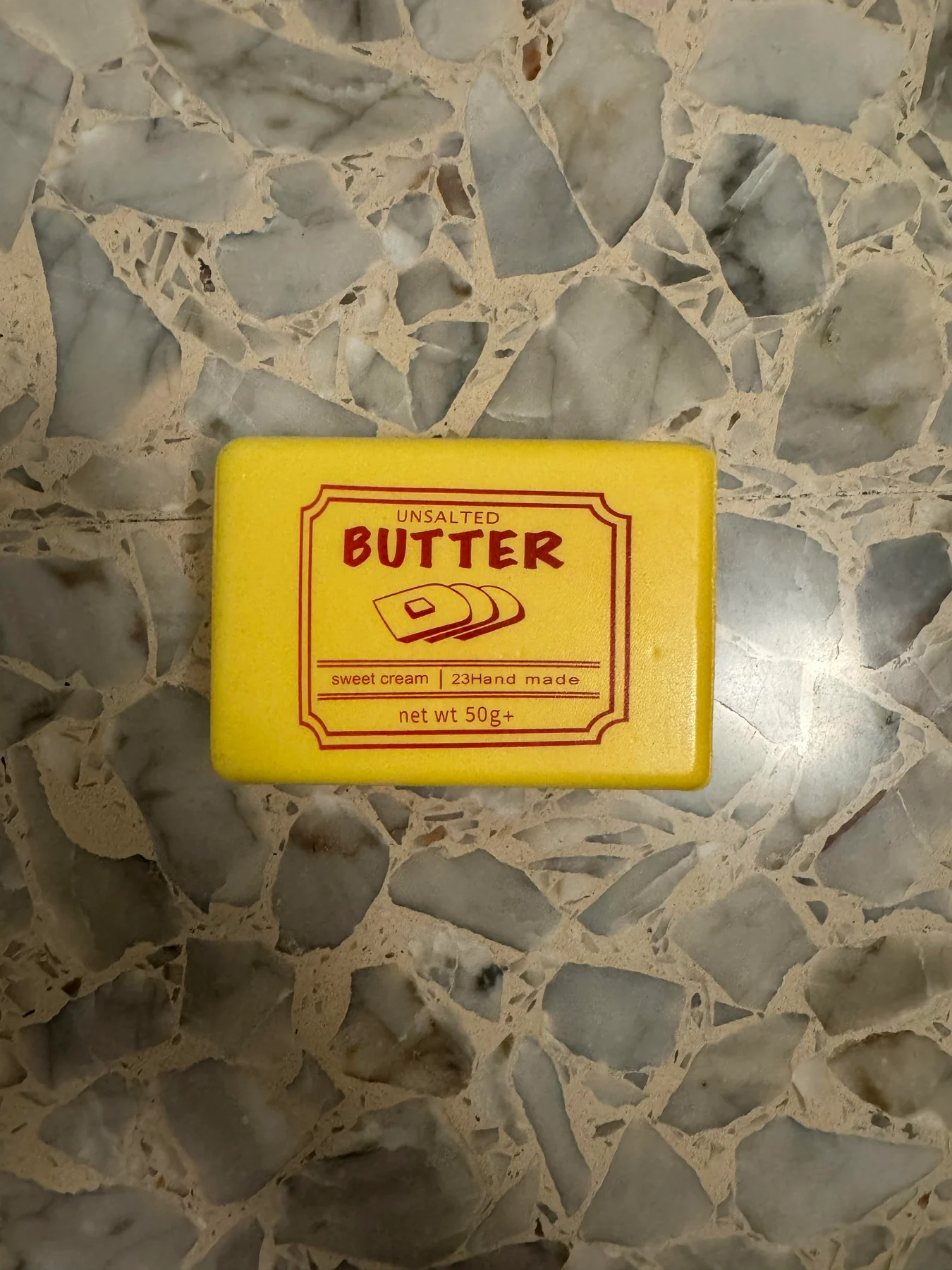 Butter-themed squishy toy in its packaging.