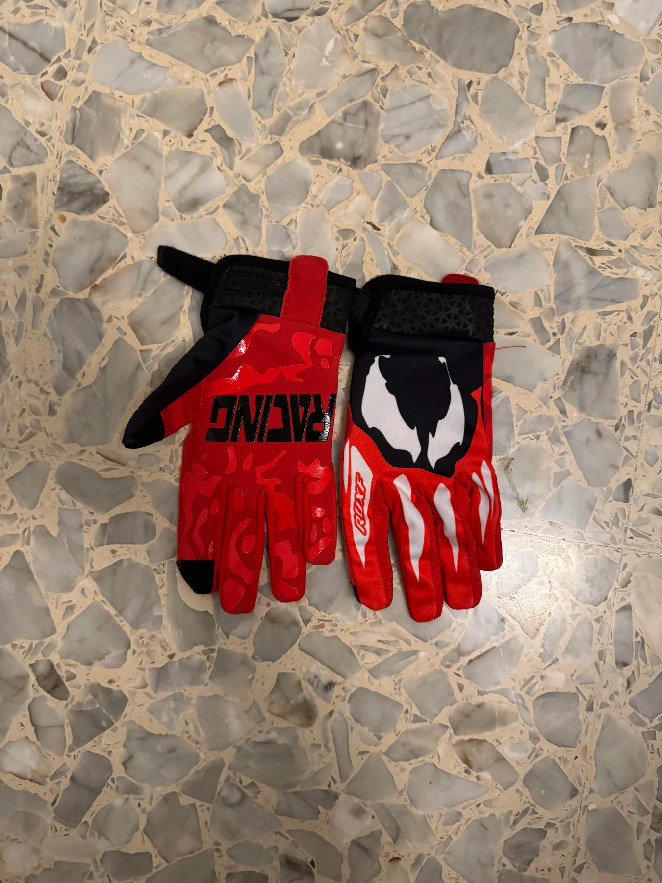 Red and black sport gloves.