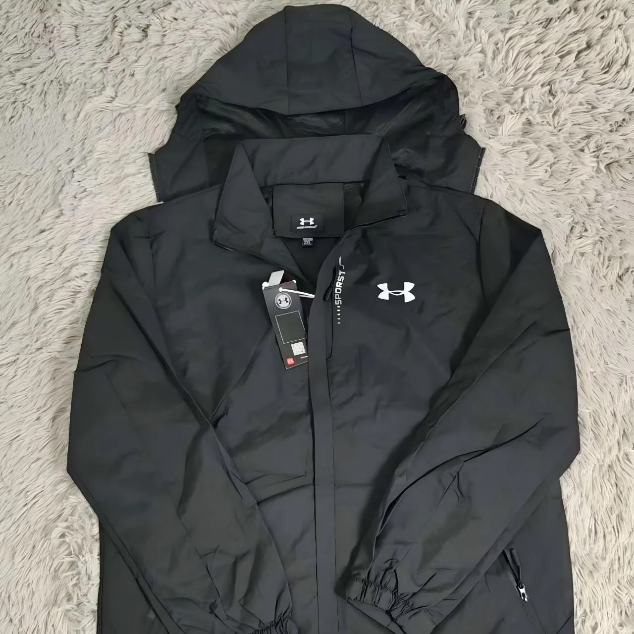Black Under Armour hooded jacket.